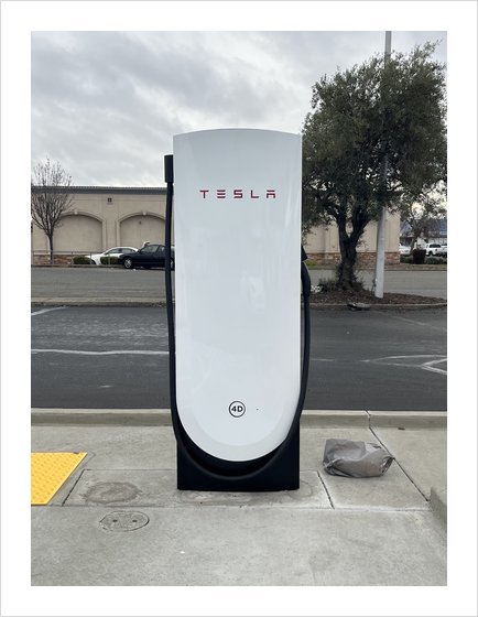 A Tesla V4 Supercharger dispenser with card reader